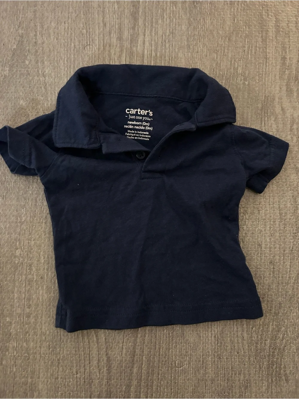 3 New born baby Carter's polo style shirts. (2 are onesies, & 1 is a shirt)